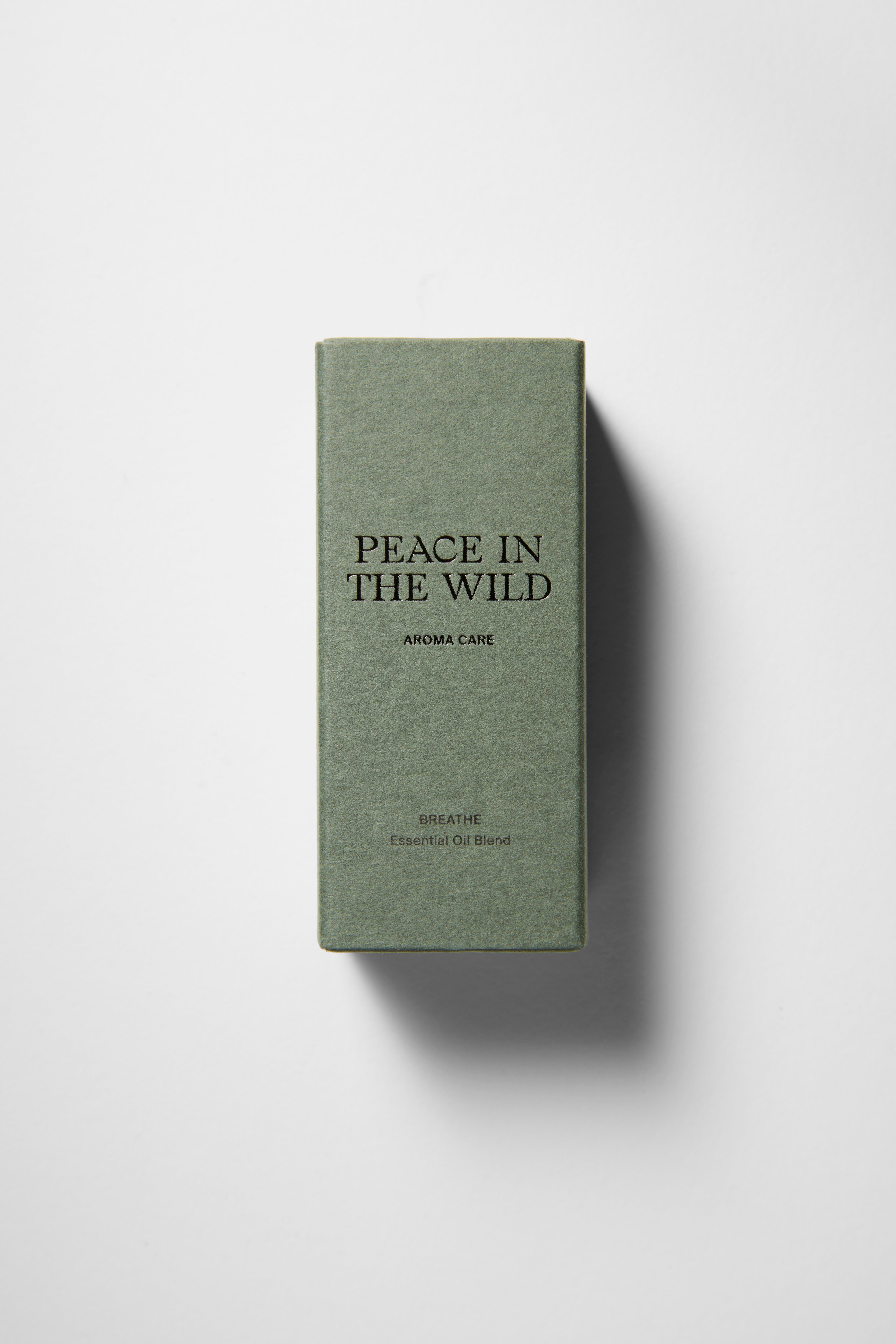 Green paper box with PEACE IN THE WILD - BREATHE Essential Oil Blend 