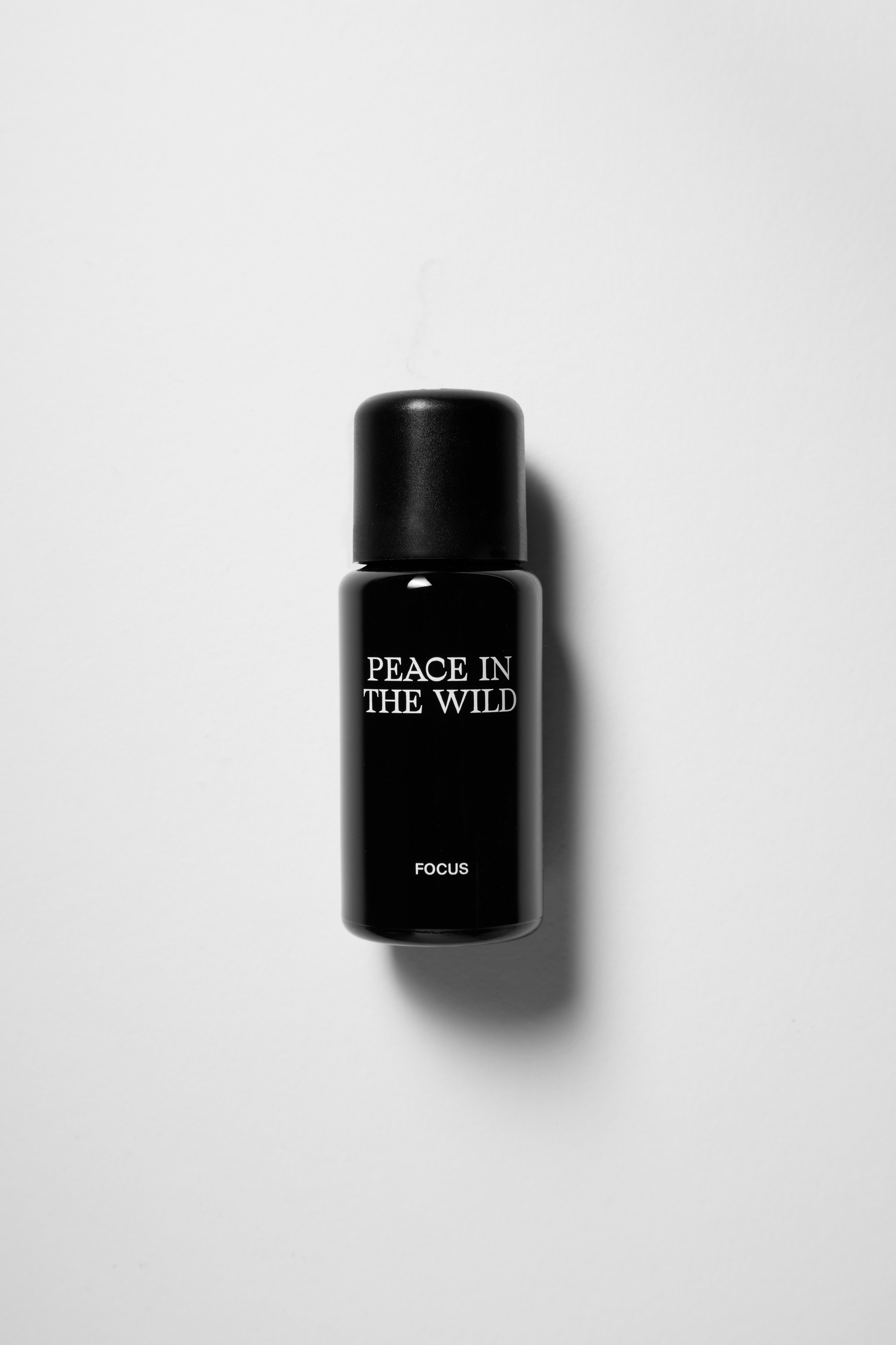 15ml black glass bottle of PEACE IN THE WILD Essential Oil Blend FOCUS 