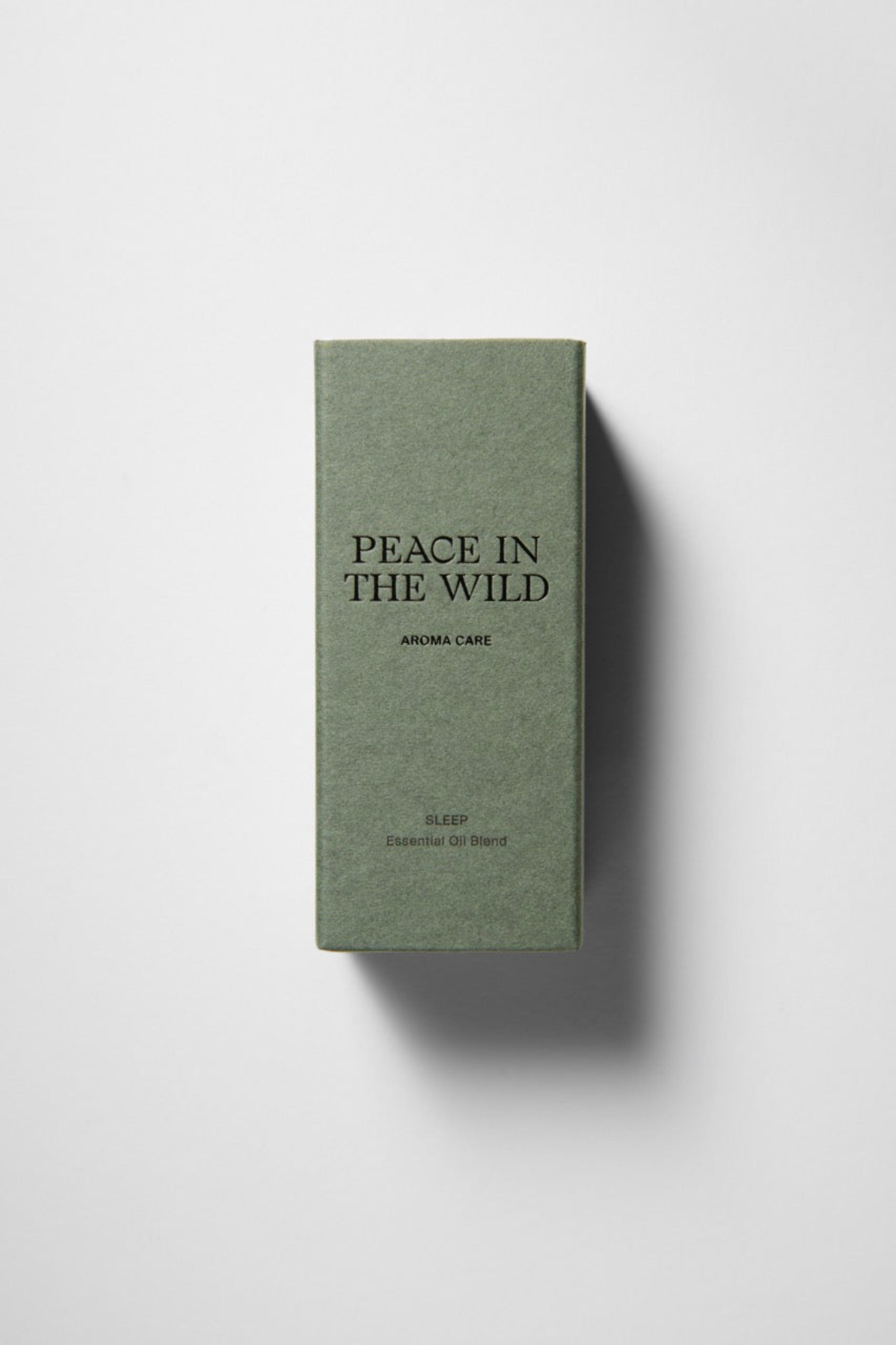 Green paper box with PEACE IN THE WILD - SLEEP Essential Oil Blend 